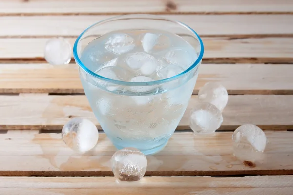 Glass full of pure water with ice balls — Stock Photo, Image