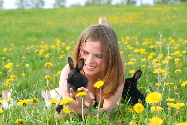 Girl with bunnies — Stock Photo, Image