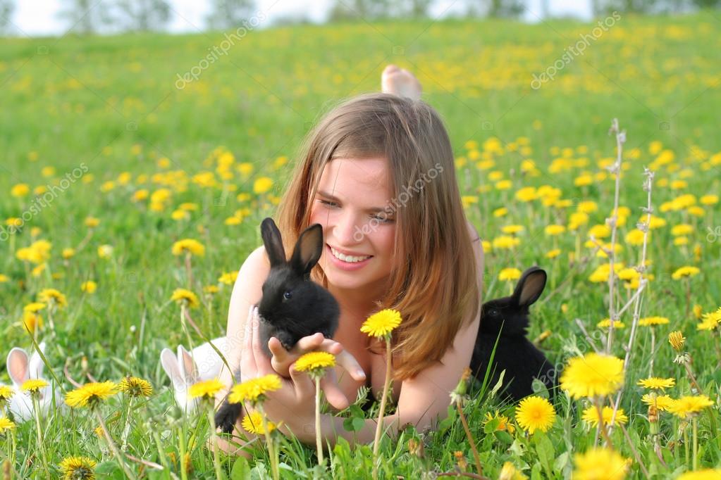 Girl with bunnies — Stock Photo © Dreef 22979798
