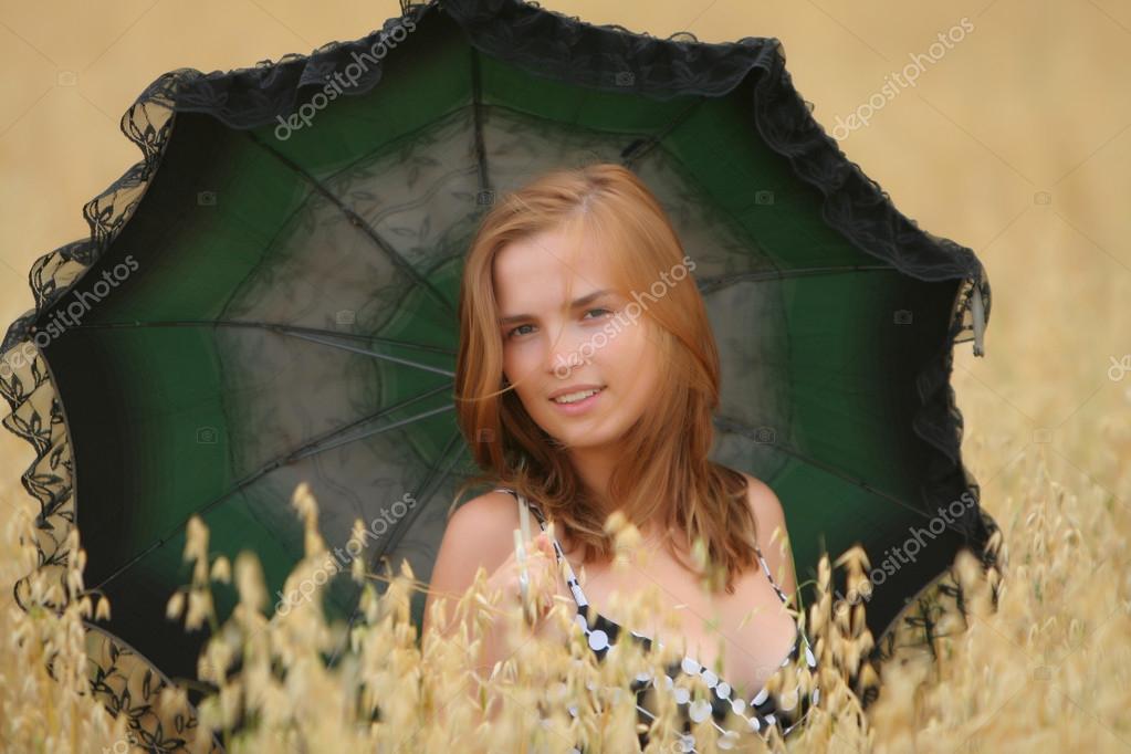 Girl with parasol — Stock Photo © Dreef 23040804