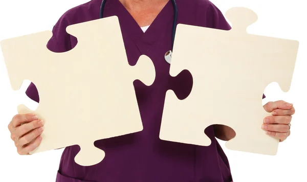 Physician Holding Puzzle Pieces — Stock Photo, Image