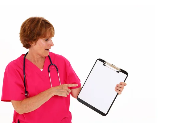 Nurse Pointing To Clipboard — Stock Photo, Image