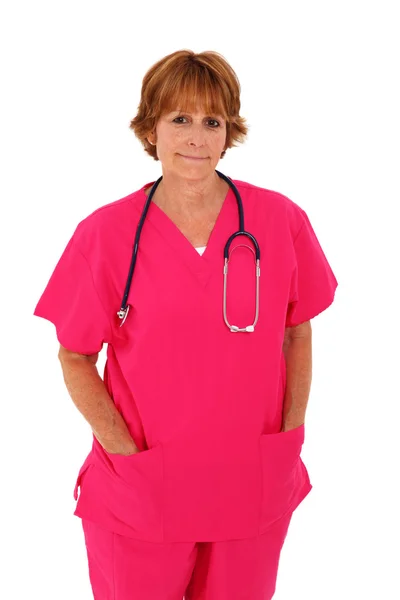 Медсестра стоїть з рожевими скраби — стокове фото