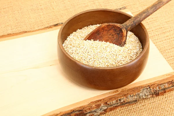 Bowl of Raw Oatmeal in Wooden Bowl — Stock Photo, Image