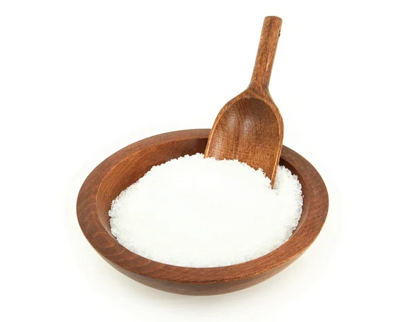 Epsom salt i träskål med skopa Stockbild