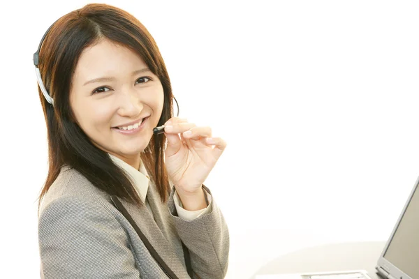 Smiling call center operator — Stock Photo, Image