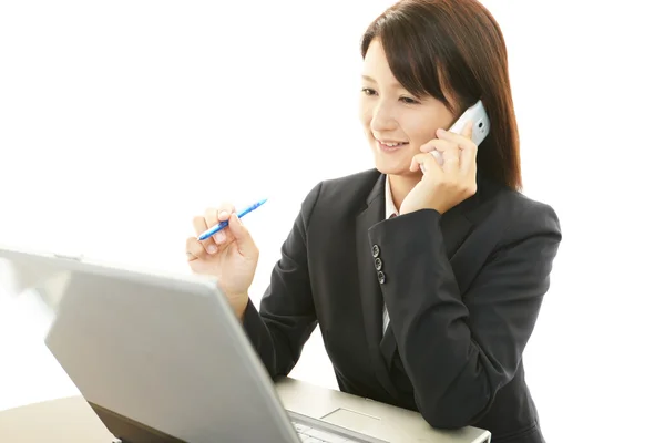 Business woman working on laptop Stock Photo