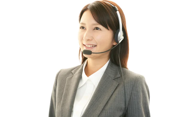 Operador de call center sorridente — Fotografia de Stock