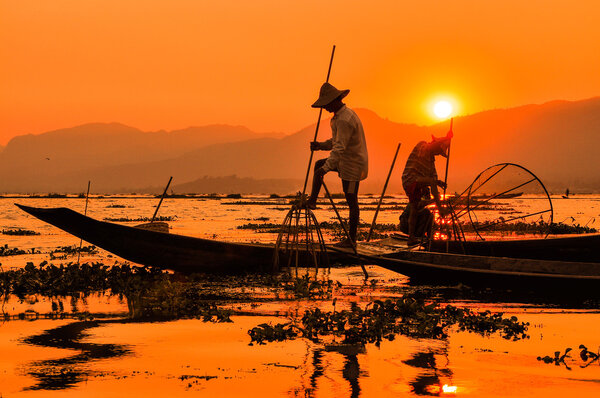 Fishermen in Inle lakes sunset, Myanmar