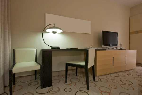 Study room with writing desk and tv set — Stock Photo, Image