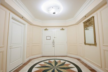 Anteroom with double door and mosaic marble floor clipart