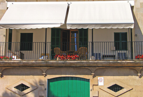 Veranda on the second floor with awning