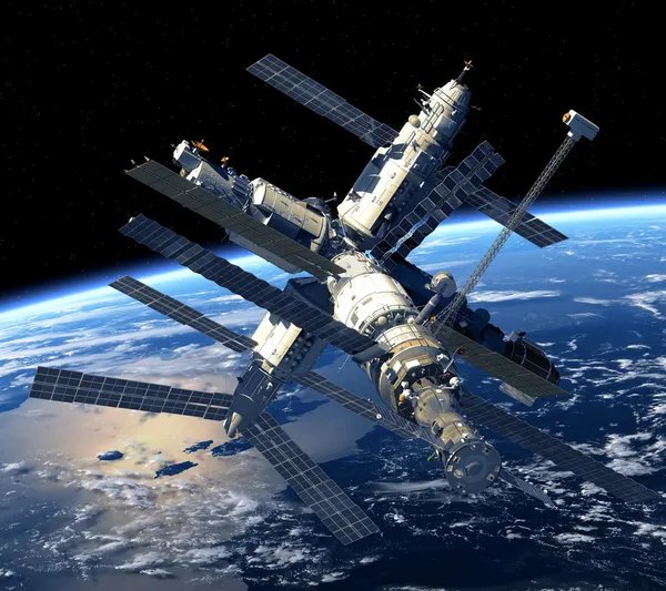 Estación espacial orbitando la tierra Fotos de stock libres de derechos