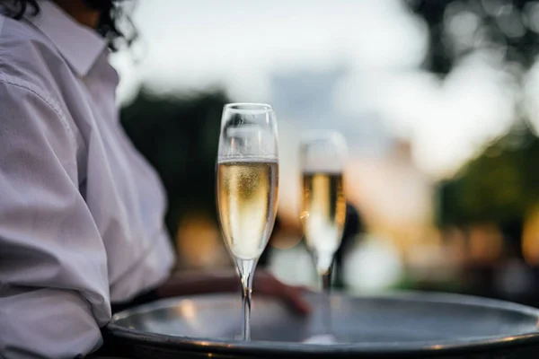 Luxury wine and CHAMPAGNE  for fine dining with and glassware, beautiful blurred  background. For events, weddings.  props for weddings, birthdays, and celebration. Wedding, restaurant.