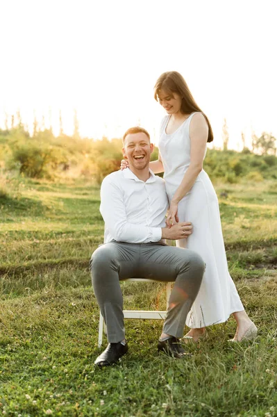 Couple Love Hug Have Fun Sunset Sunny Day Guy Sits — Stock Photo, Image