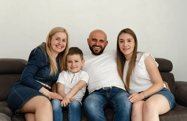 Cheerful Family Sitting Sofa Home Bald Father Beard Hugs His — Stock Photo, Image