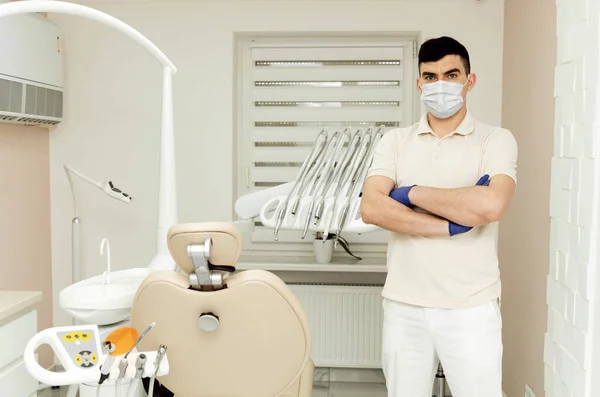 Practicing Dentist Protective Mask Protective Gloves His Hands Folded His — Stock Photo, Image