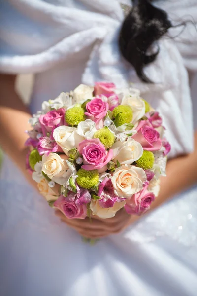Bride holding beautiful wedding bouquet — Stock Photo, Image