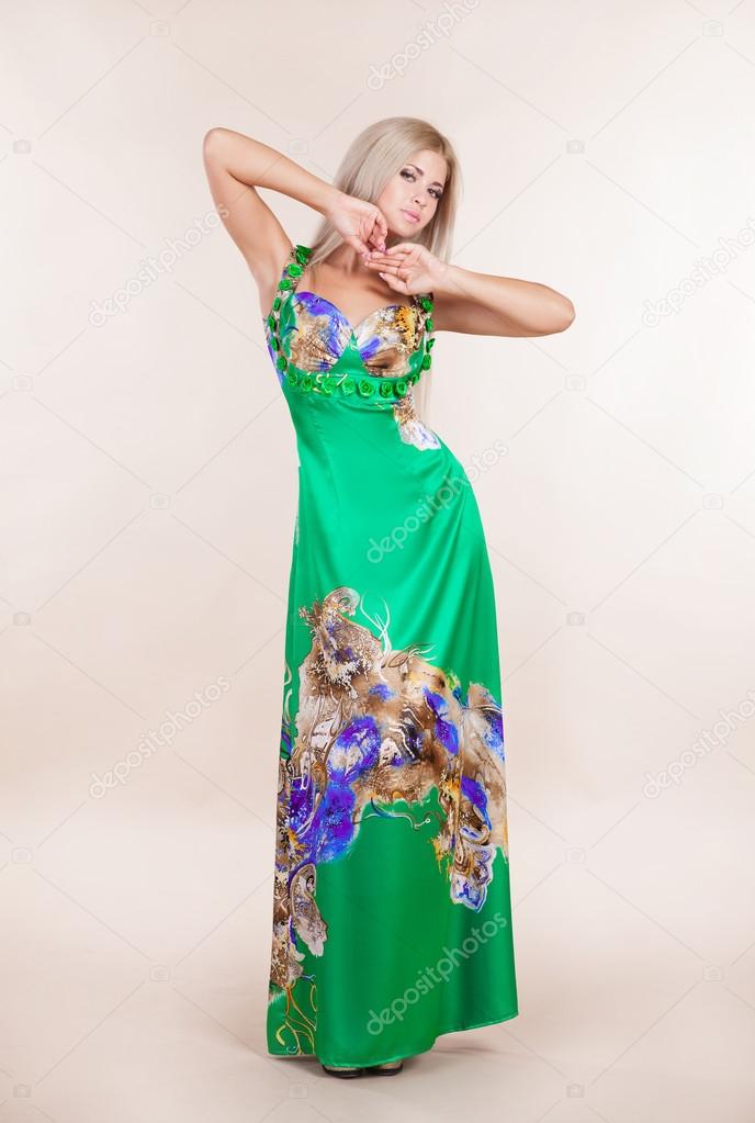Attractive fashion girl in green dress