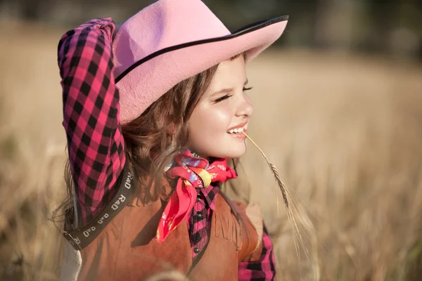 Cowboy girl in golden wheat — Stock Photo, Image