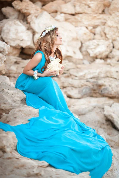 Beautiful Fantasy woman in long blue dress and seashell wreath — Stock Photo, Image