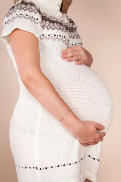 Happy young pregnant woman touching her belly — Stock Photo, Image