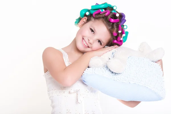 Lovely little girl portrait in curlers and pajamas, skincare kid beauty and glamour. — Stock Photo, Image