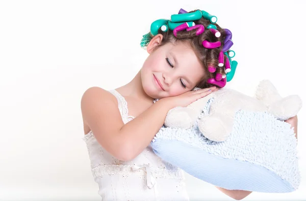 Lovely little girl portrait in curlers and pajamas, skincare kid beauty and glamour. — Stock Photo, Image