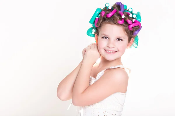 Lovely little girl portrait in curlers and pajamas, skincare kid beauty and glamour. — Stock Photo, Image