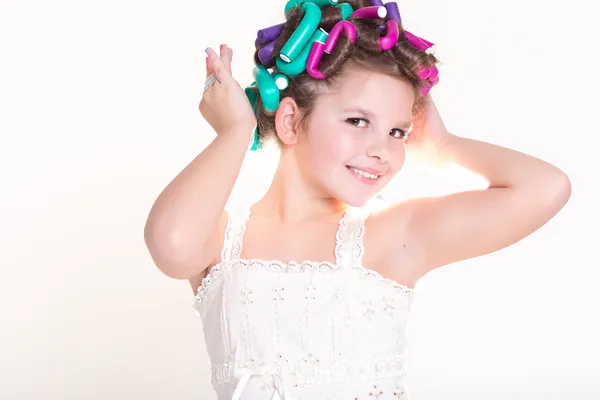 Lovely little girl portrait in curlers and pajamas, skincare kid beauty and glamour. — Stock Photo, Image