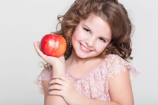 Happy child eating apples healthy organic food, little girl with red apple — Stock Photo, Image