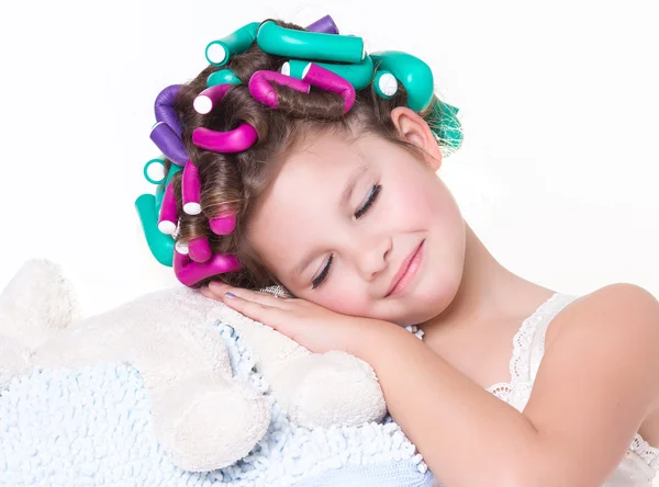 Lovely little girl portrait in curlers and pajamas, skincare kid beauty and glamour. — Stock Photo, Image