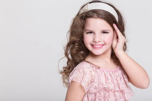 Fashion little girl isolated, lovely girl in beige dress in studio — Stock Photo, Image