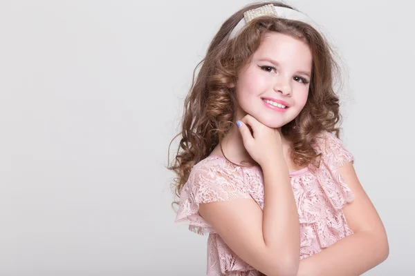 Fashion little girl isolated, lovely girl in beige dress in studio — Stock Photo, Image