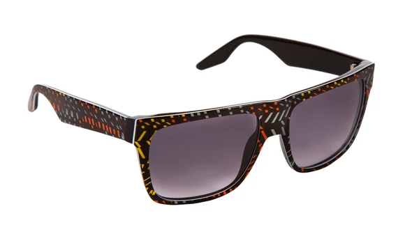 Schwarz umrandete Sonnenbrille mit bunten Konfetti-Stücken — Stockfoto