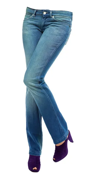 Young woman crossed legs with clear blue jeans and purple peep t — Stock Photo, Image