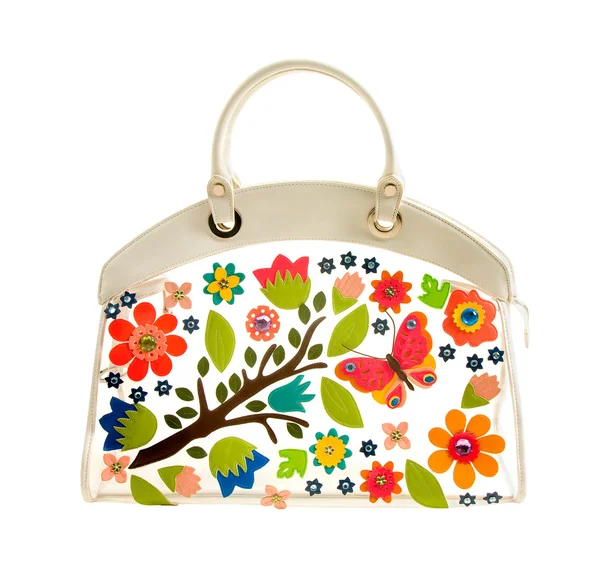 Прозрачная белая кожаная сумка с разноцветными кожаными цветами — стоковое фото