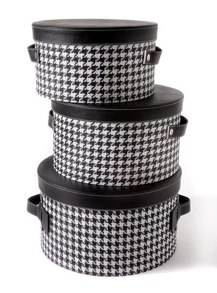 Set of houndstooth check and black leather bandboxes — Stock Photo, Image