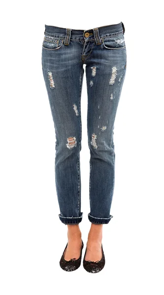 Piernas de mujer joven en jeans desgastados y bailarinas de lentejuelas Imagen de stock