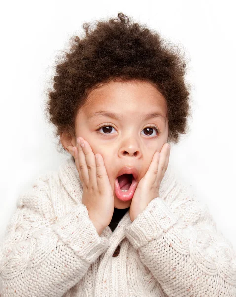 Dropped jaw surprised child with hands on face — Stock Photo, Image