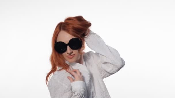 Young girl posing in funny glasses — Stock Video