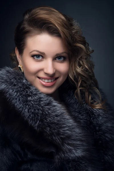 Portrait of young girl, blonde in fur coat — Stock Photo, Image