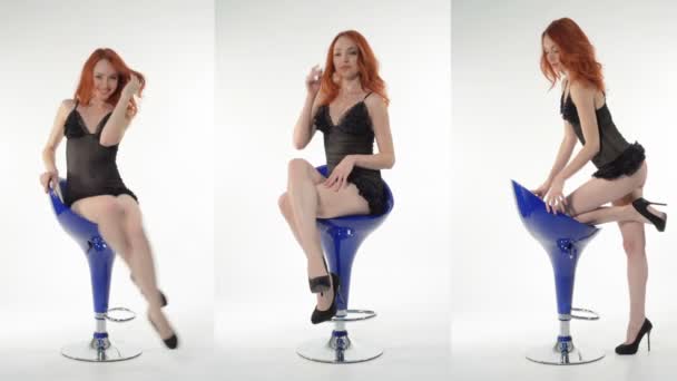 Девушка на синем стуле — стоковое видео