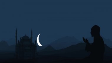 Bir müslüman cami ve yükselen ay için dua eder. Ramazan tatili. 