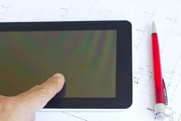Man working with tablet over engineering diagram — Stock Photo, Image