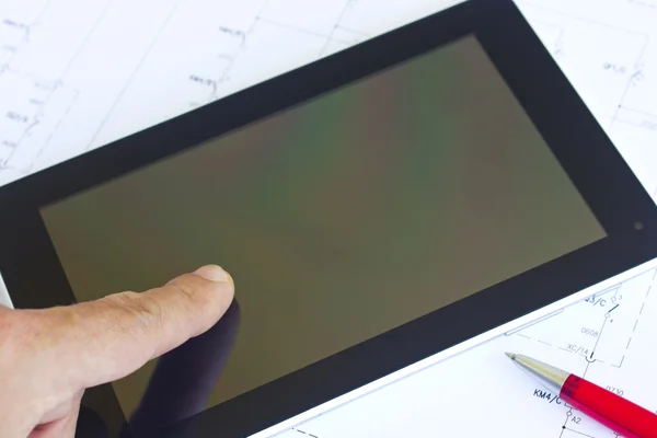 Man working with tablet over engineering diagram — Stock Photo, Image