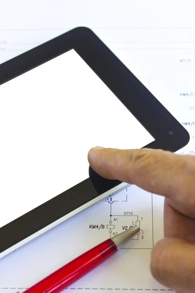 Man working with tablet over engineering diagram — Stock Photo, Image