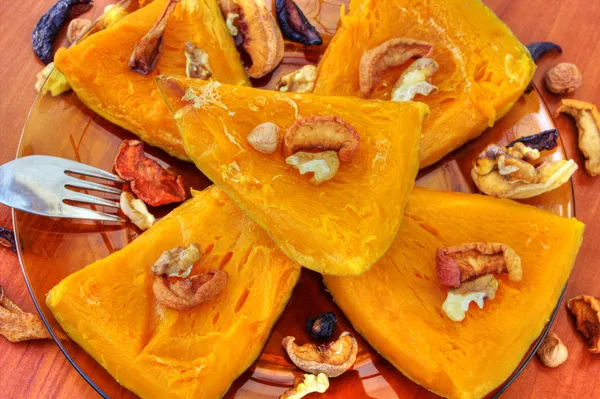 Baked pumpkin with dried fruits and nuts — Stock Photo, Image