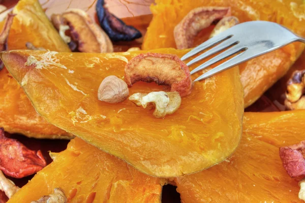 Baked pumpkin with dried fruits and nuts — Stock Photo, Image