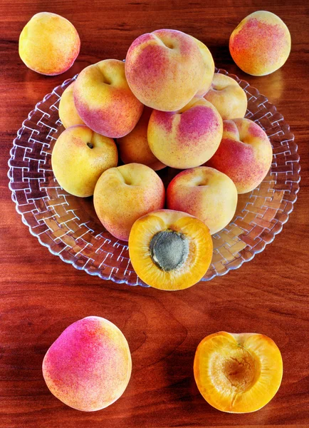 Apricots on wooden table — Stock Photo, Image